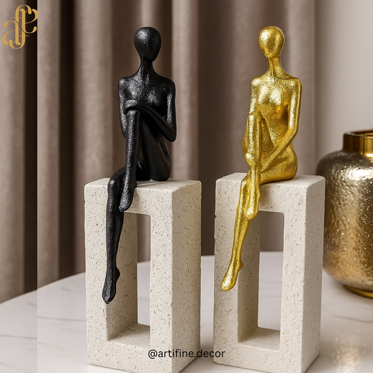 Elegant Sitting Figurines on Stone Blocks