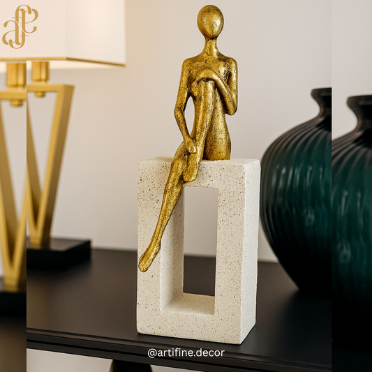 Elegant Sitting Figurines on Stone Blocks